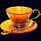 Чашка чайная ажурная из янтаря с ложкой с декором из белой бронзы